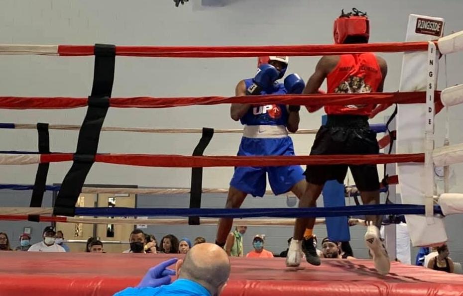 Boxing competitors in action